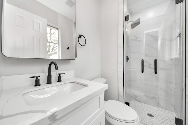 9414 Colleen Rd, Houston, TX 77080 - bathroom with toilet, vanity, and a marble finish shower