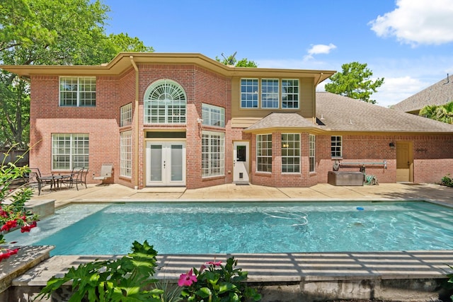 1915 Landon Point Cir, Katy, TX 77450 - back of house with a patio area, french doors, brick siding, and an outdoor pool