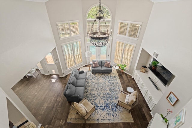 1915 Landon Point Cir, Katy, TX 77450 - living room featuring a high ceiling, a chandelier, hardwood / wood-style floors, plenty of natural light, and baseboards