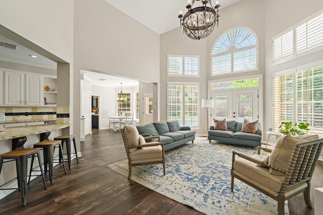 1915 Landon Point Cir, Katy, TX 77450 - living room with a chandelier, a towering ceiling, dark wood-style floors, and baseboards