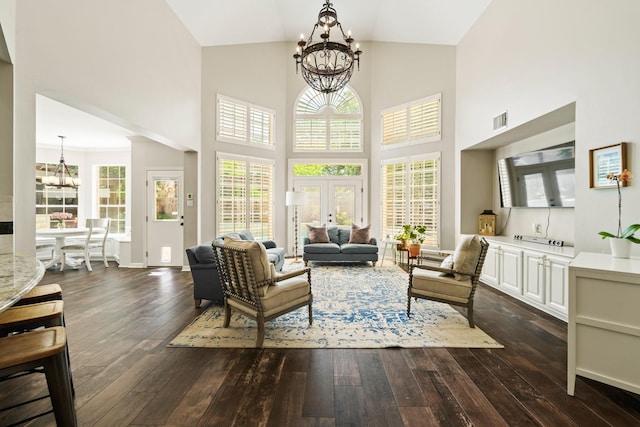1915 Landon Point Cir, Katy, TX 77450 - living area with a chandelier, dark wood-style flooring, high vaulted ceiling, and plenty of natural light
