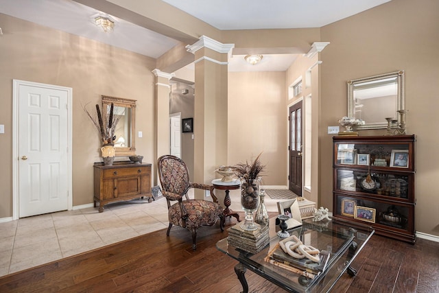 10235 Shipmans Landing Dr, Missouri City, TX 77459 - living area featuring decorative columns, wood-type flooring, and baseboards