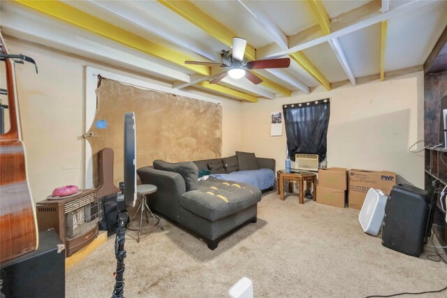 1806 State St, Houston, TX 77007 - carpeted living room featuring ceiling fan, beamed ceiling, and a wood stove