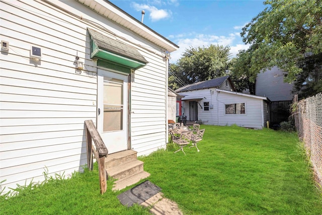 1806 State St, Houston, TX 77007 - view of yard with entry steps and an outdoor structure