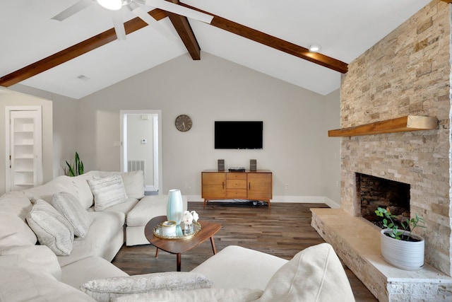 907 Eva Dr, Katy, TX 77493 - living room with ceiling fan, dark wood-style floors, baseboards, and a stone fireplace