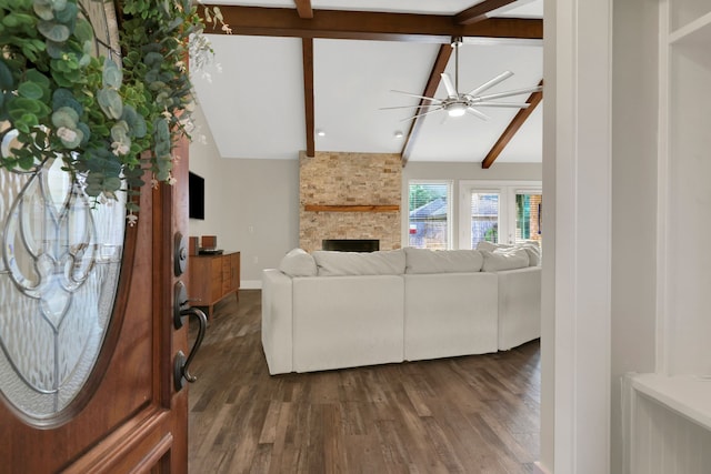 907 Eva Dr, Katy, TX 77493 - living area featuring a stone fireplace, ceiling fan, and dark wood-style flooring