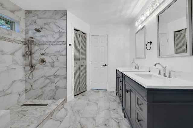 907 Eva Dr, Katy, TX 77493 - bathroom with marble look tiles, double vanity, a closet, and a marble finish shower