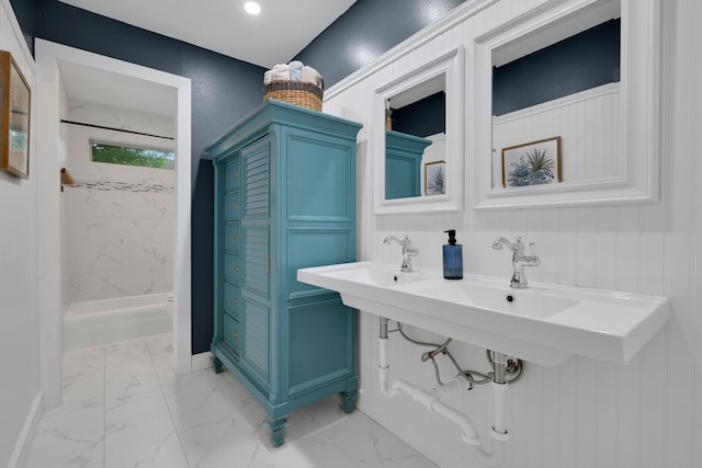 907 Eva Dr, Katy, TX 77493 - full bathroom featuring a shower, marble look tile flooring, and baseboards