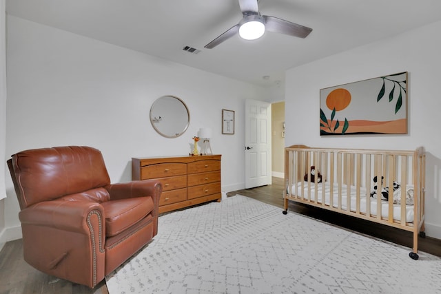 907 Eva Dr, Katy, TX 77493 - bedroom featuring wood finished floors, baseboards, and a ceiling fan