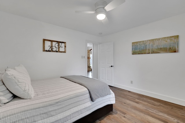 907 Eva Dr, Katy, TX 77493 - bedroom with wood finished floors, baseboards, and a ceiling fan