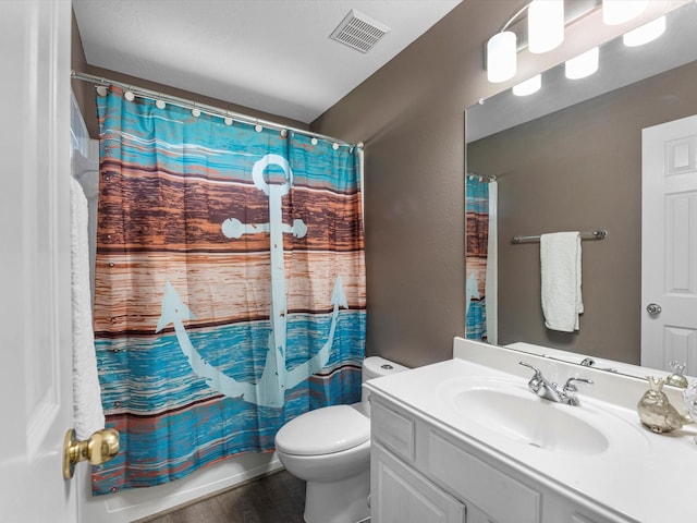 25169 Nutley Cir, Porter, TX 77365 - bathroom with vanity, toilet, wood finished floors, and shower / bath combination with curtain