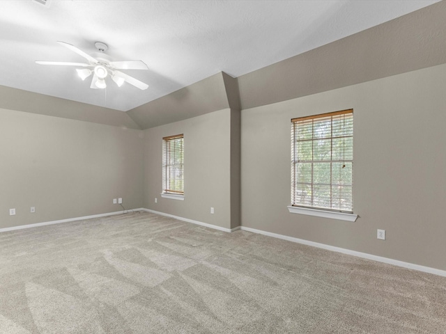 25169 Nutley Cir, Porter, TX 77365 - empty room featuring ceiling fan, carpet, baseboards, and lofted ceiling