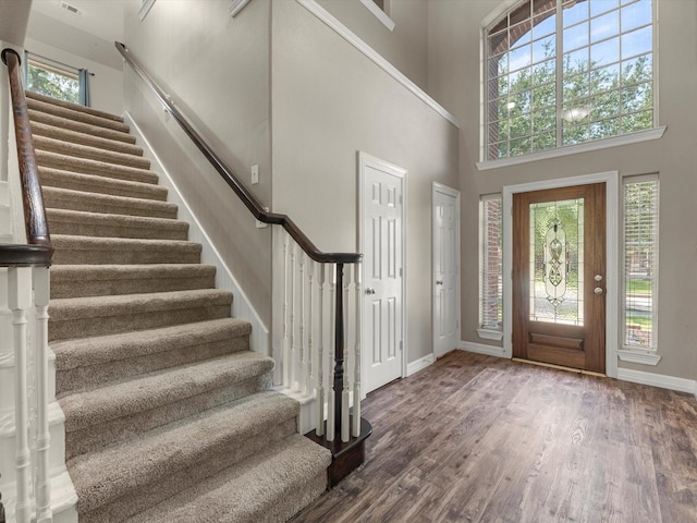 25169 Nutley Cir, Porter, TX 77365 - entryway with stairway, wood finished floors, baseboards, and a high ceiling
