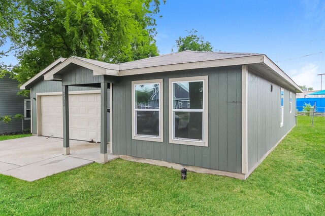2722 Stallings Dr, Houston, TX 77088 - view of front of home featuring a garage, concrete driveway, and a front yard
