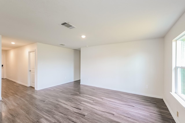 2722 Stallings Dr, Houston, TX 77088 - spare room with plenty of natural light, wood finished floors, baseboards, and recessed lighting
