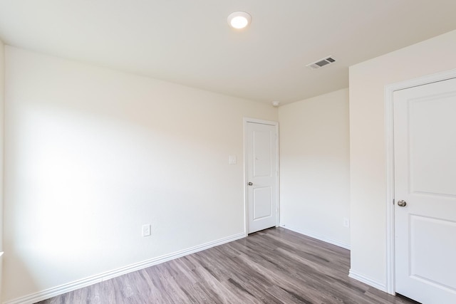 2722 Stallings Dr, Houston, TX 77088 - unfurnished bedroom featuring wood finished floors and baseboards