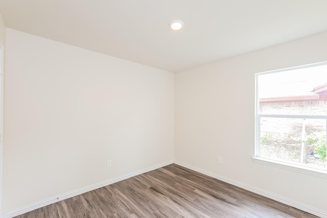 2722 Stallings Dr, Houston, TX 77088 - unfurnished room featuring wood finished floors, baseboards, and recessed lighting