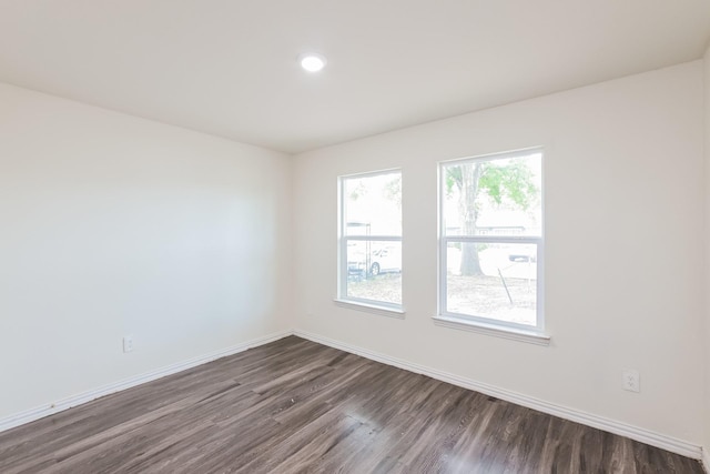 2722 Stallings Dr, Houston, TX 77088 - spare room featuring dark wood-type flooring, baseboards, and recessed lighting