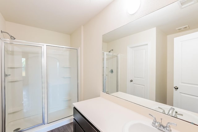 2722 Stallings Dr, Houston, TX 77088 - full bathroom with a stall shower, vanity, and wood finished floors