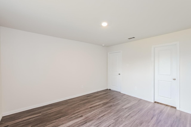 2722 Stallings Dr, Houston, TX 77088 - unfurnished bedroom with wood finished floors and baseboards