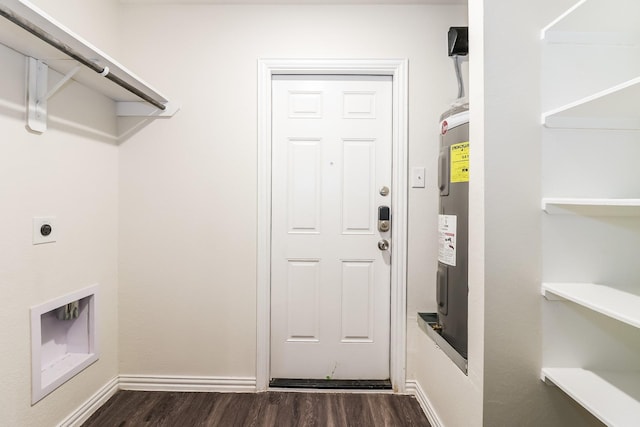 435 Connecticut St, Houston, TX 77029 - laundry area with hookup for an electric dryer, dark wood-style flooring, electric water heater, and baseboards