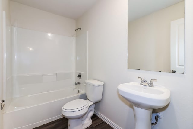 435 Connecticut St, Houston, TX 77029 - bathroom featuring toilet, wood finished floors, shower / washtub combination, and baseboards