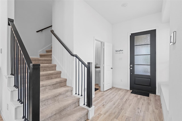 4050 Champlain Way, Rosharon, TX 77583 - entryway featuring stairway, light wood-style flooring, and baseboards