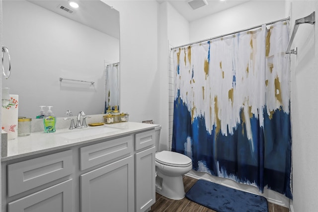 4050 Champlain Way, Rosharon, TX 77583 - bathroom with vanity, toilet, and wood finished floors