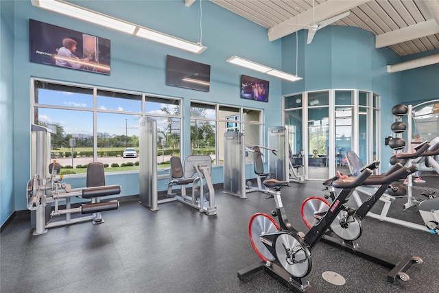 4050 Champlain Way, Rosharon, TX 77583 - gym featuring wooden ceiling with exposed beams, a towering ceiling, and baseboards