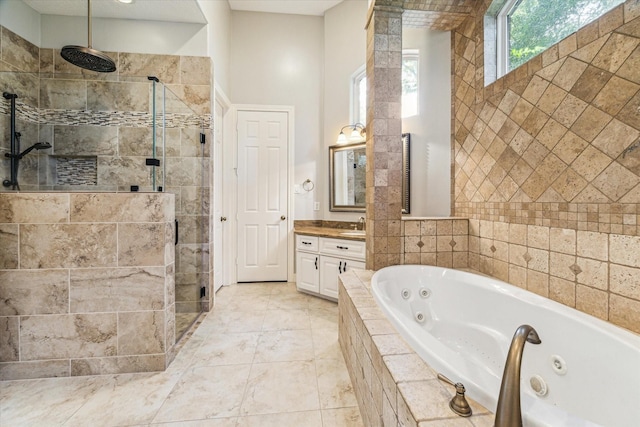 2215 Timbershade Ct, Magnolia, TX 77355 - bathroom featuring a stall shower, vanity, and a jetted tub