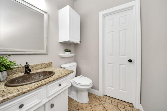 3306 Candlelon Dr, Spring, TX 77388 - bathroom with vanity, toilet, tile patterned floors, and baseboards