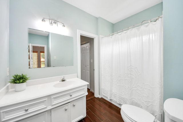 3306 Candlelon Dr, Spring, TX 77388 - bathroom with toilet, vanity, wood finished floors, and curtained shower