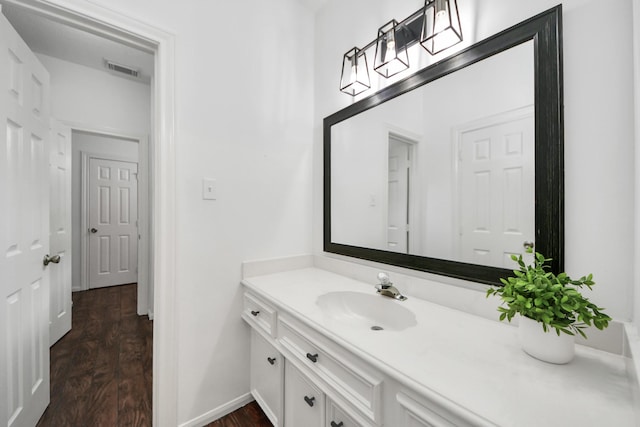 3306 Candlelon Dr, Spring, TX 77388 - bathroom with wood finished floors, vanity, and baseboards