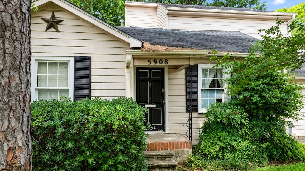 5908 Community Dr, West University Place, TX 77005 - doorway to property featuring a shingled roof