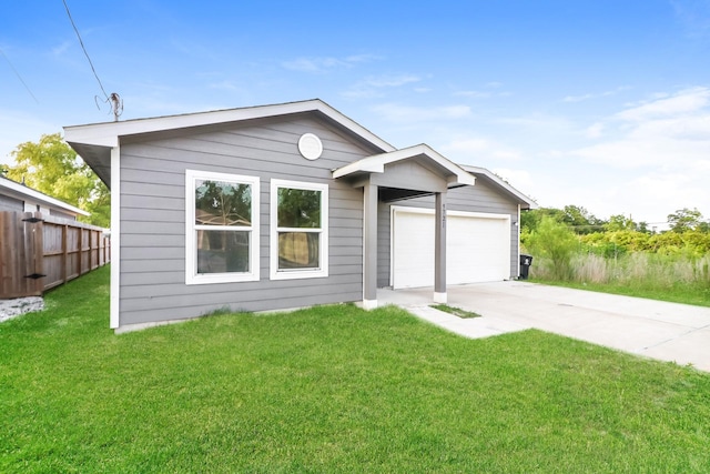 9721 Stedman St, Houston, TX 77029 - view of front of property featuring driveway and an attached garage