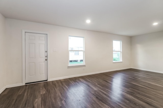 9721 Stedman St, Houston, TX 77029 - foyer with dark wood finished floors, baseboards, and recessed lighting