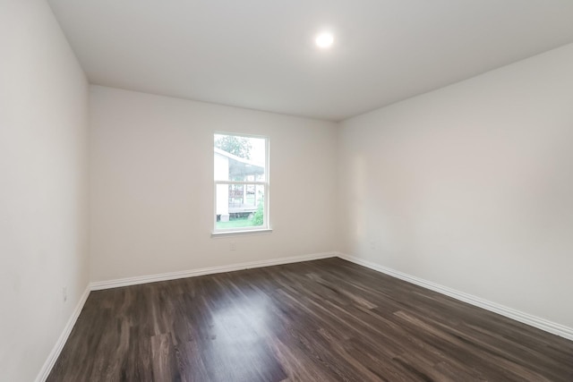 9721 Stedman St, Houston, TX 77029 - unfurnished room with baseboards and dark wood-style floors