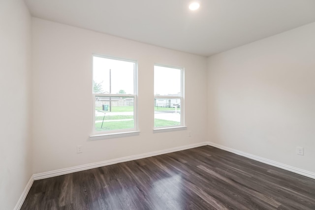 9721 Stedman St, Houston, TX 77029 - unfurnished room with dark wood-type flooring and baseboards