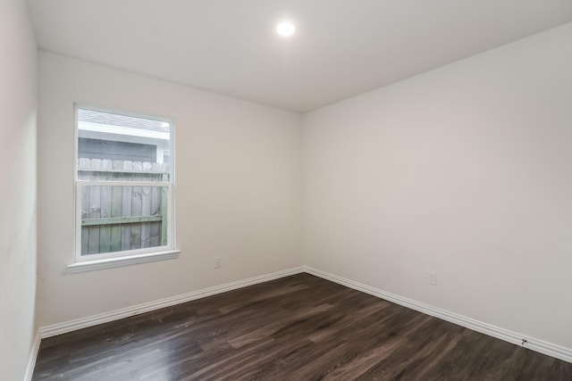 9721 Stedman St, Houston, TX 77029 - unfurnished room with dark wood finished floors and baseboards
