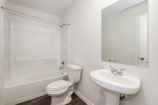 9721 Stedman St, Houston, TX 77029 - full bath with wood finished floors, toilet, tub / shower combination, and baseboards
