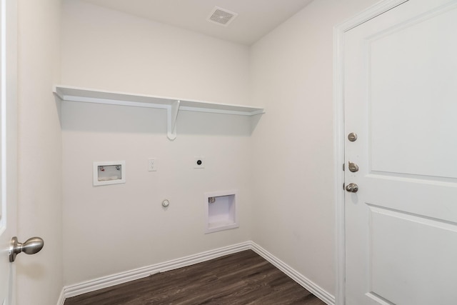9721 Stedman St, Houston, TX 77029 - laundry room featuring gas dryer hookup, electric dryer hookup, hookup for a washing machine, dark wood-style flooring, and baseboards