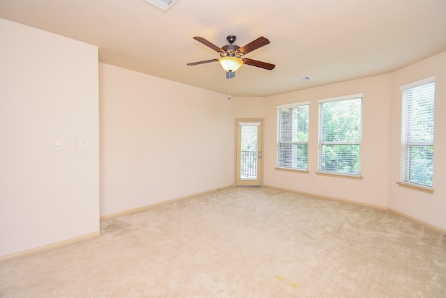 2614 Palm Harbour Dr, Missouri City, TX 77459 - empty room with light carpet, ceiling fan, and baseboards