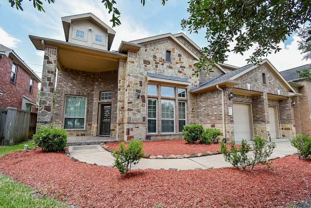 2614 Palm Harbour Dr, Missouri City, TX 77459 - view of front of house with stone siding, an attached garage, and brick siding