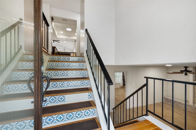 13 Whistlers Ct, The Woodlands, TX 77380 - stairway with wood finished floors and a ceiling fan
