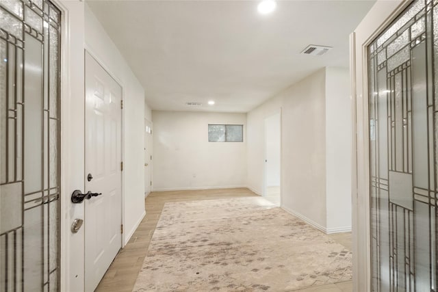 13 Whistlers Ct, The Woodlands, TX 77380 - hall featuring recessed lighting, light wood-style floors, and baseboards