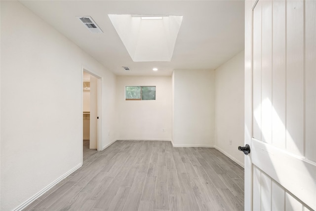 13 Whistlers Ct, The Woodlands, TX 77380 - empty room with light wood-type flooring, baseboards, and recessed lighting