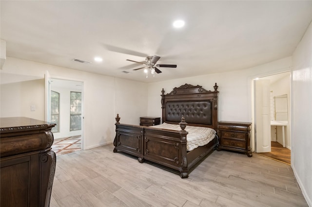 13 Whistlers Ct, The Woodlands, TX 77380 - bedroom with baseboards, light wood-type flooring, a ceiling fan, ensuite bath, and recessed lighting