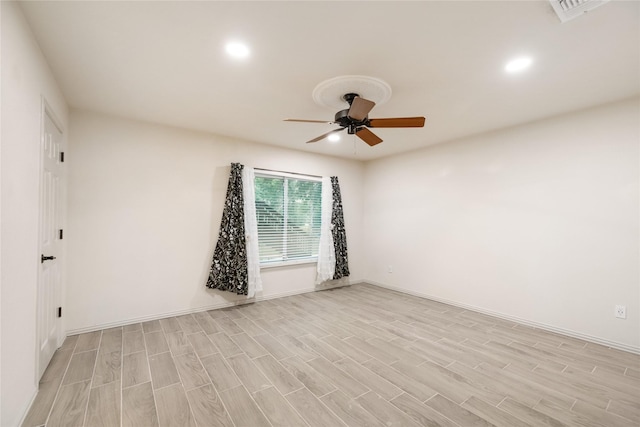 13 Whistlers Ct, The Woodlands, TX 77380 - unfurnished room with a ceiling fan, light wood finished floors, recessed lighting, and baseboards