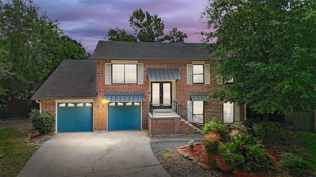 13 Whistlers Ct, The Woodlands, TX 77380 - bi-level home featuring concrete driveway, brick siding, a shingled roof, and french doors