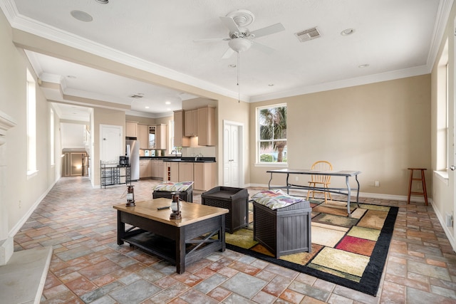 1854 Tiki Dr, Tiki Island, TX 77554 - living room with stone tile floors, a ceiling fan, baseboards, ornamental molding, and recessed lighting